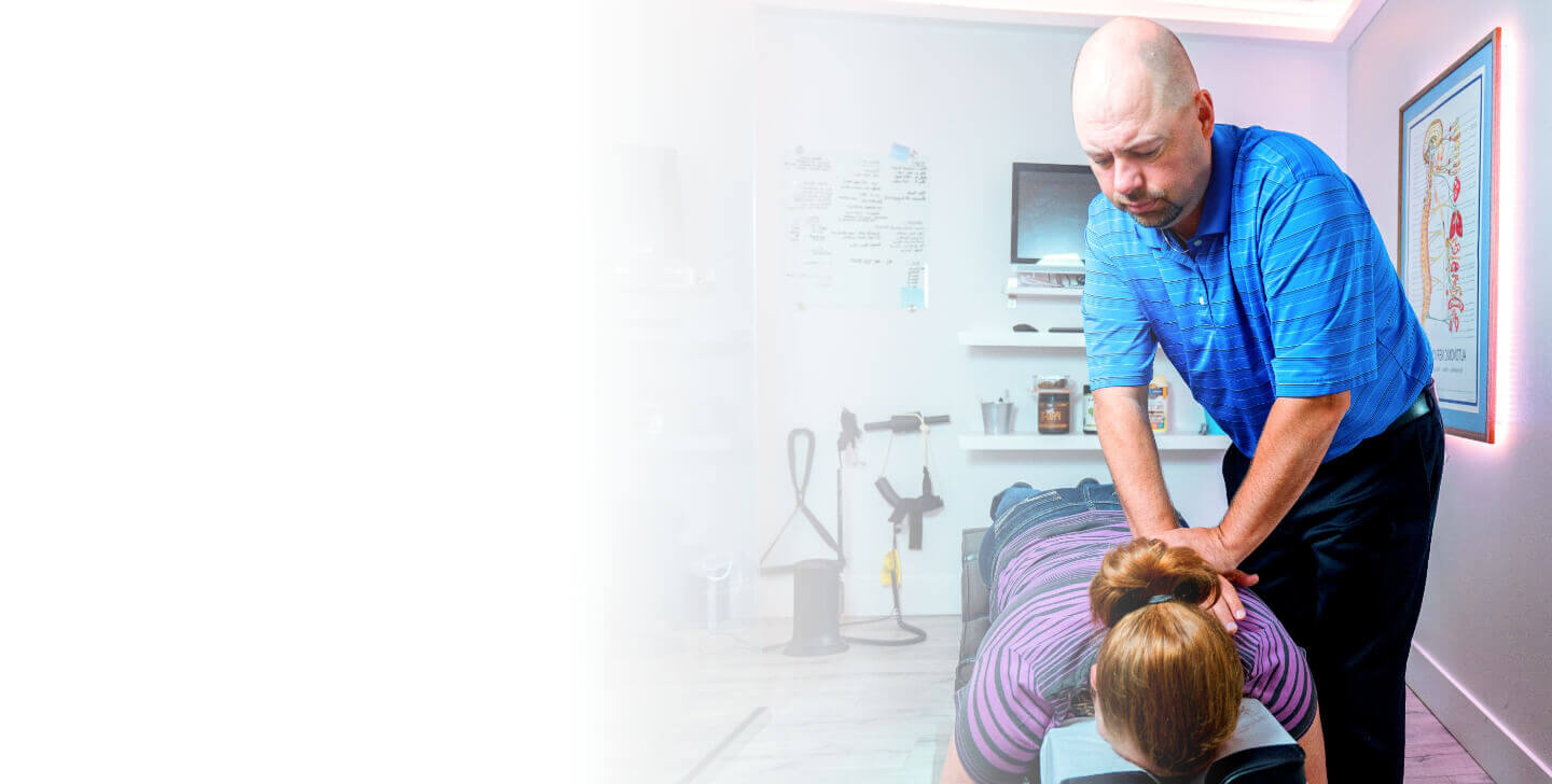 South Calgary Chiropractor Dr. Dale Byrne adjusting patient