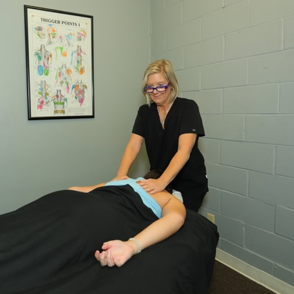 Woman receiving therapeutic massage