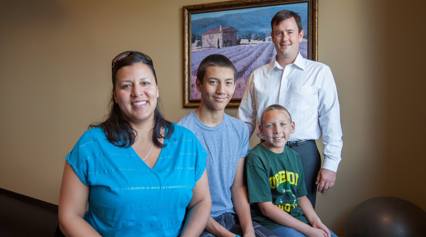 Prineville chiropractor Dr. Hanes with a mom and her two sons