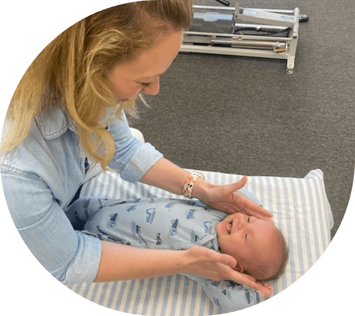 chiropractor adjusting baby