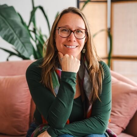 Dr. Carly sitting on a chair