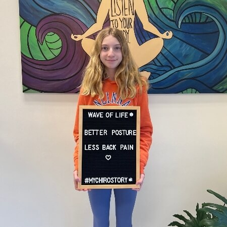 Young woman holding a sign