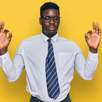 Man stands tall meditative hands