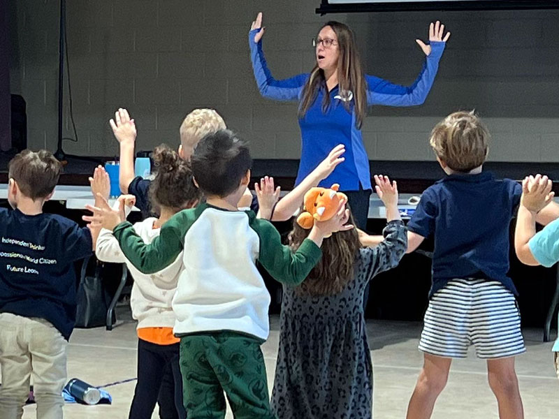 Dr. Carly & Dr. Krista teaching posture exercises to local elementary schools