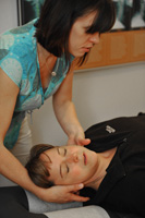 Dr. Graham adjusts a patient's neck.