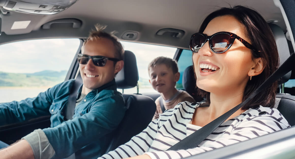 Smiling family in vehicle