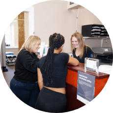 Patients at Driscoll Chiropractic Care Clinic reception desk