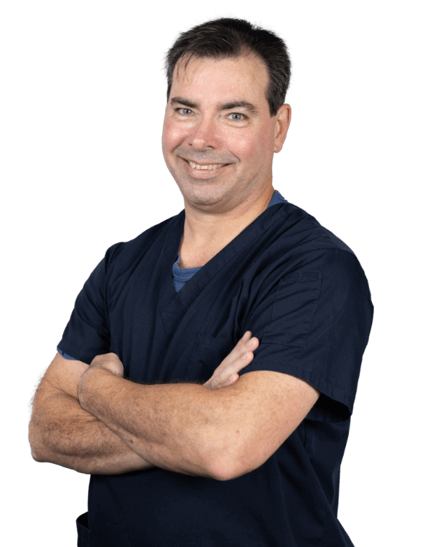 Thorold chiropractor Dr. Driscoll posing with arms folded