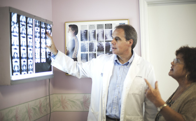 Fort Pierce chiropractor explains the best course of care for you. Chiropractor goes over your report of findings.