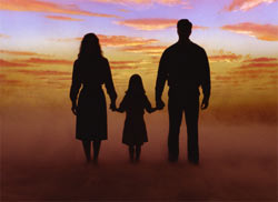 Family walking in sunset