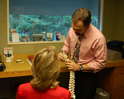 Dr. John talking to patient