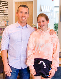 Dr hanson with patient wearing orange hoodie