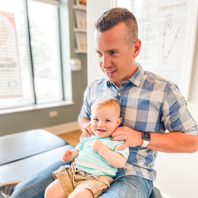 Dr. David adjusting baby boy