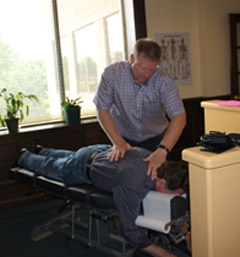 Dr. Herron adjusting a patient.