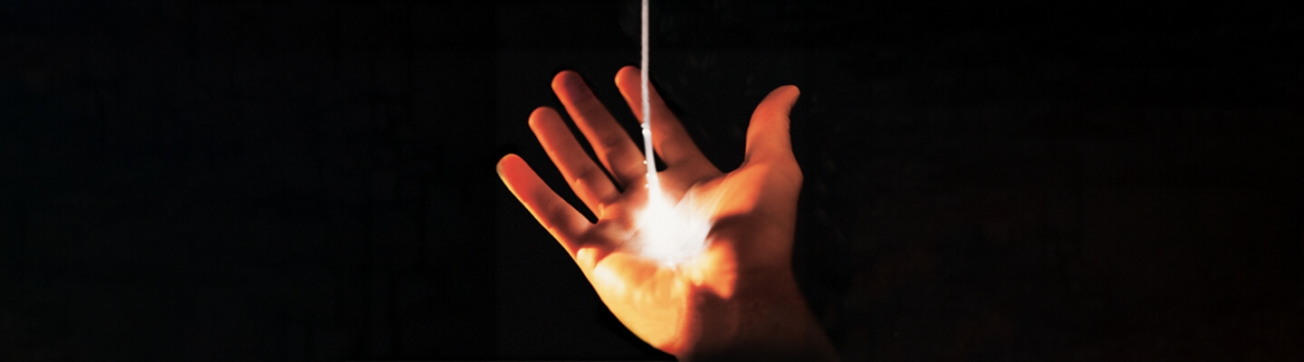 hand with light beam coming out of the palm