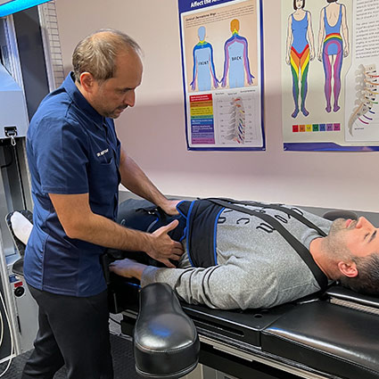 patient on a spinal decompression table