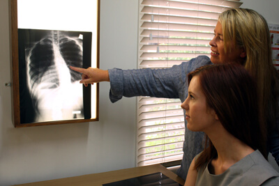 Chiropractor explaining xrays to patient