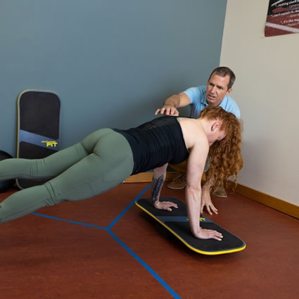 Woman on exercise board