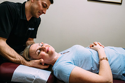 Doctor adjusting womans neck