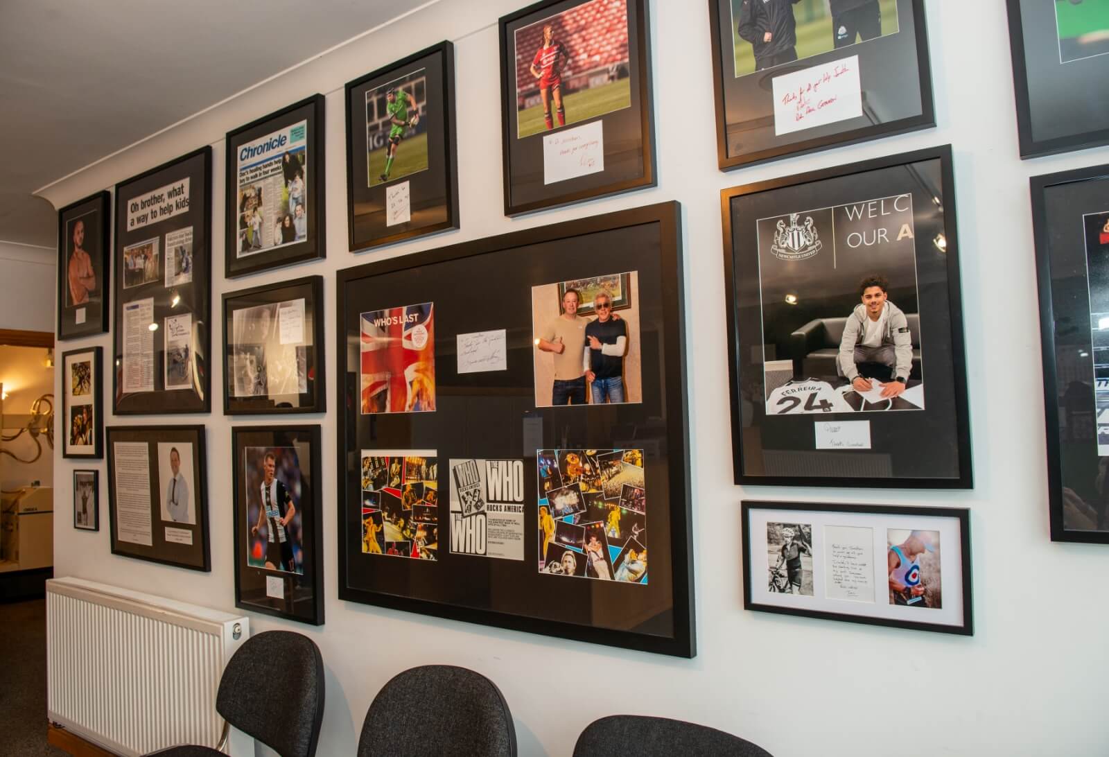 wall of posters at Vitality Chiropractic