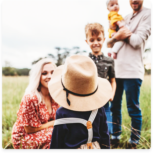 family standing in field