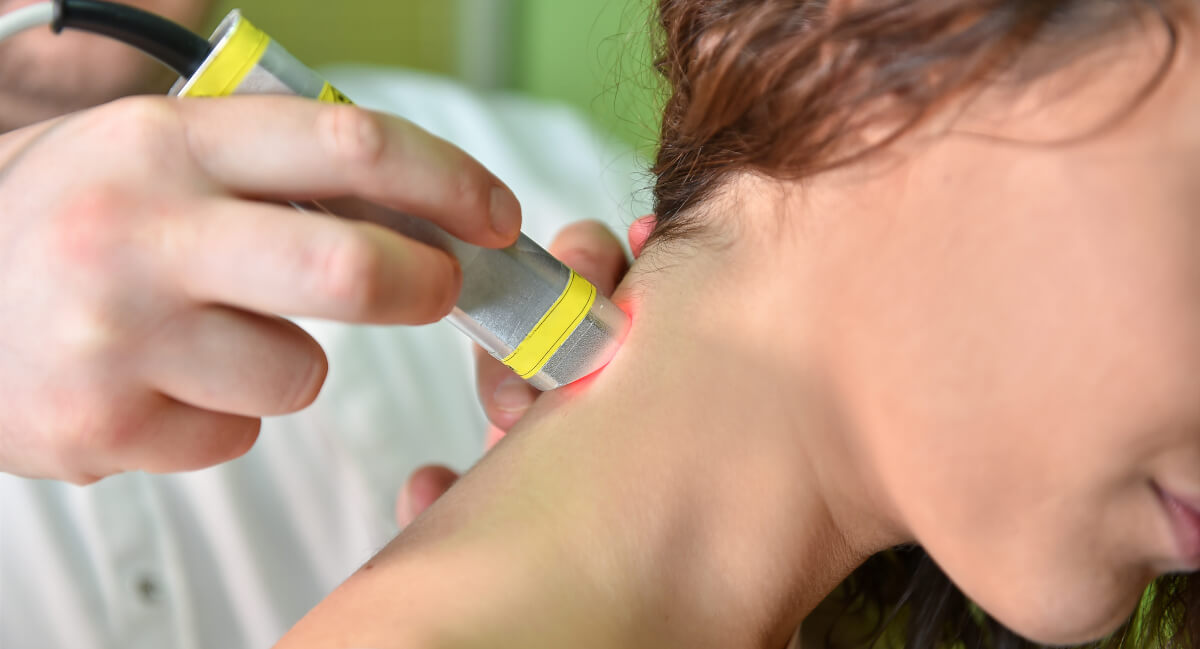 Female patient being treated with laser therapy