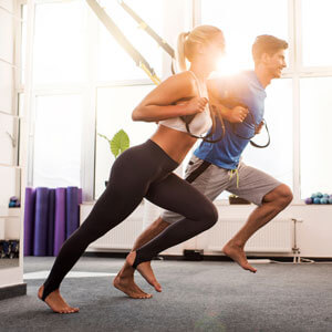 man and woman stretching