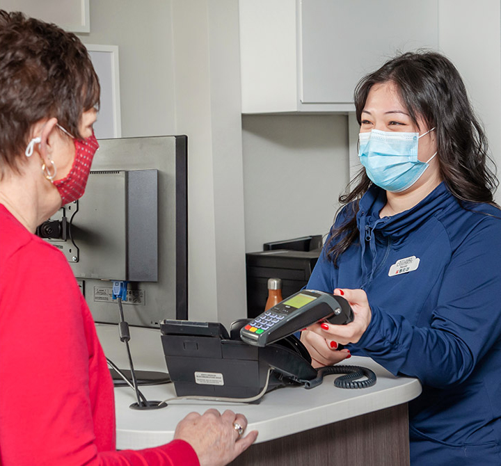 Staff checking out patient