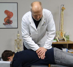 Dr. Seitz adjusting a patient.