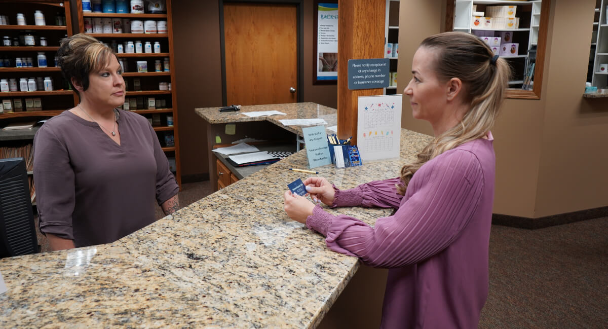 Marshall patient checking in at reception