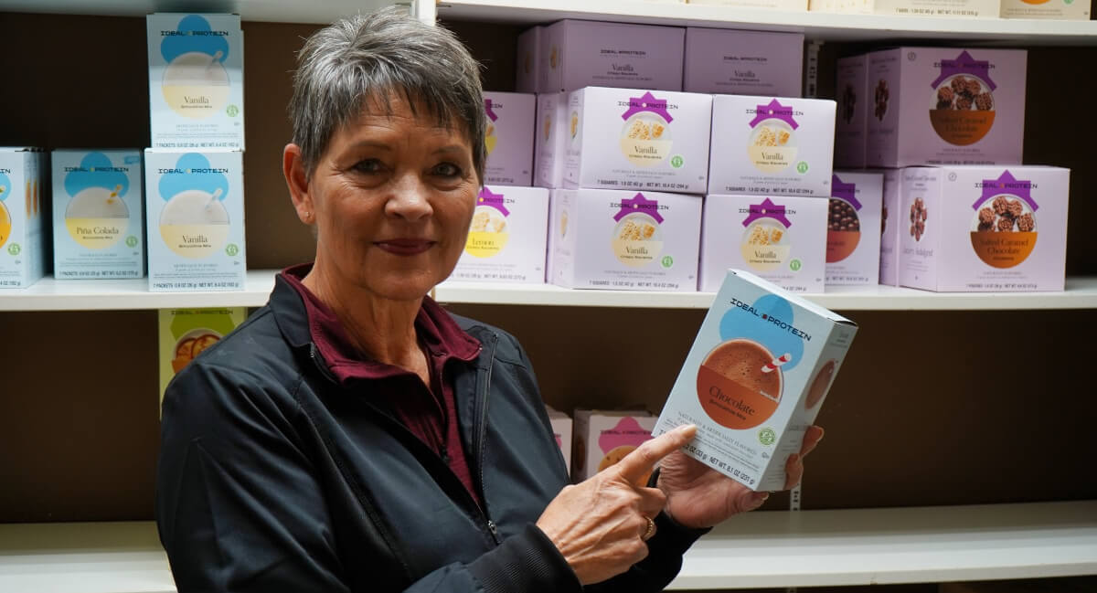 Hoganson Chiropractic Center staff holding ideal protein package