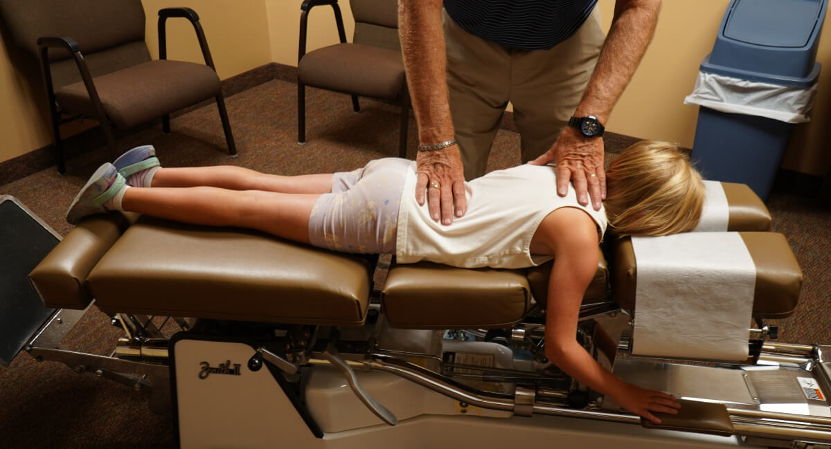 Pediatric patient receiving a chiropractic adjustment