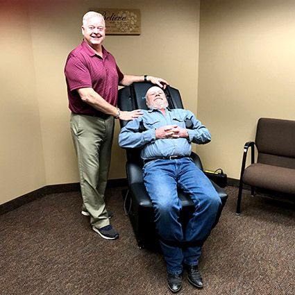 Man laying on reclined table