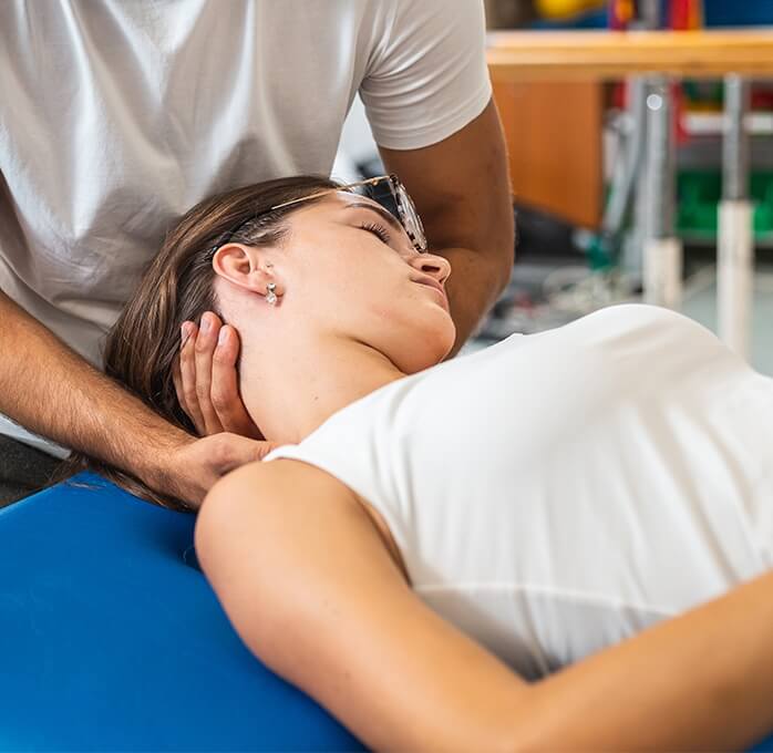 woman having neck adjusted