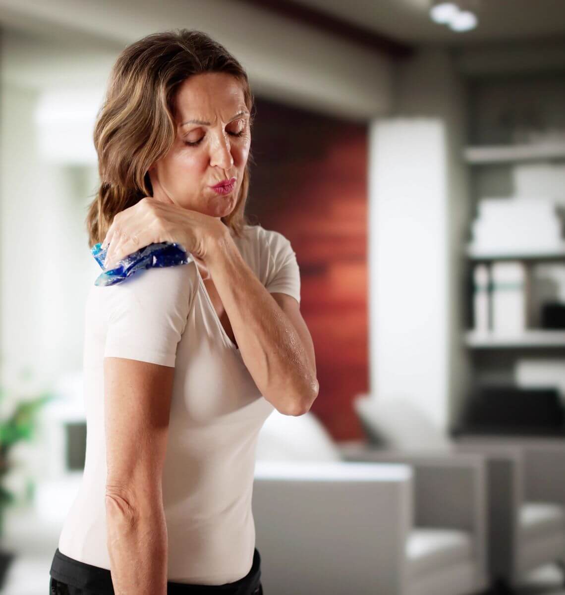 woman-raises-her-arm-to-her-shoulder