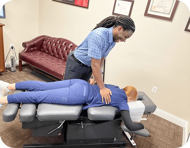 Dr. Richardson adjusting a patient's back