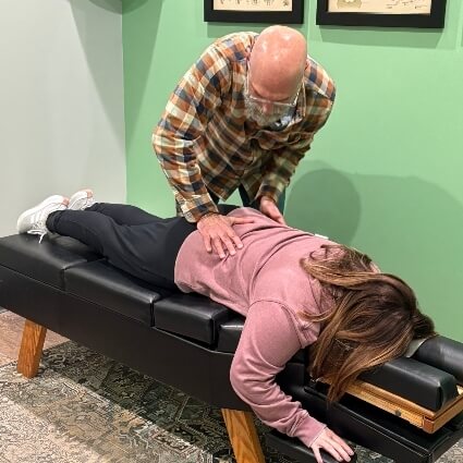 Nicholasville chiropractor Dr. Jeffries adjusting a female patient