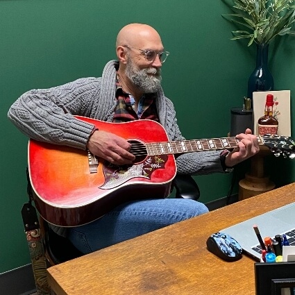 Nicholasville chiropractor Dr. Jeffries playing guitar