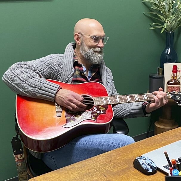 Nicholasville chiropractor Dr. Jeffries playing guitar