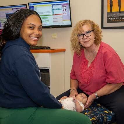 Raynham Chiropractor Dr. Margie adjusting baby