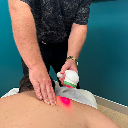 Cold laser therapy on patients back
