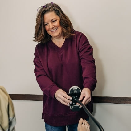 laser therapy technician smiling