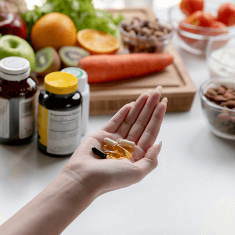 Female hands holding supplements