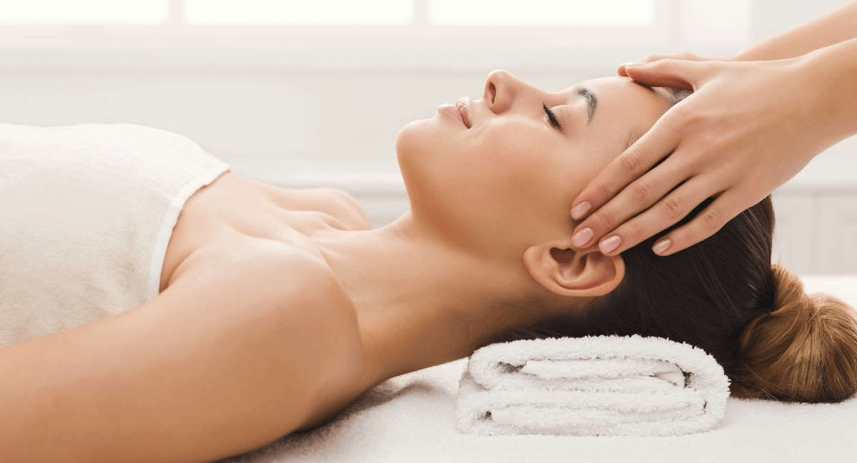 Female patient receiving a gentle head massage