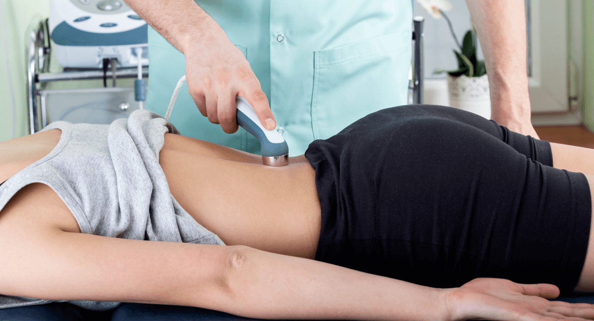 Female patient receiving laser therapy on her back