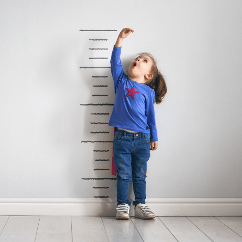 Little girl checking her height