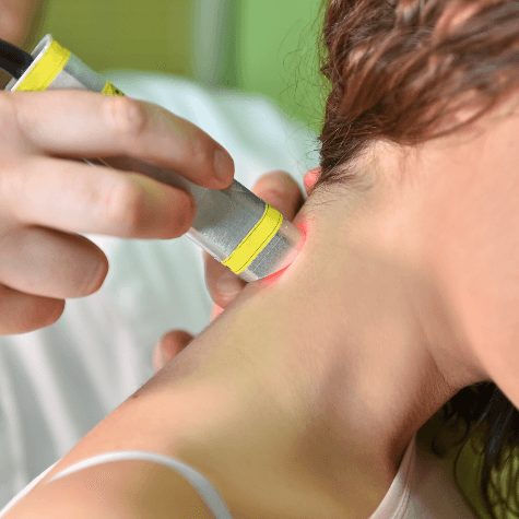Laser therapy used on female patient's neck