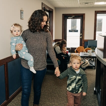 patient walking into our office with children