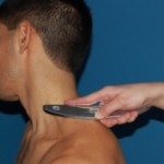 Muscles of the neck being treated with an IASTM instrument
