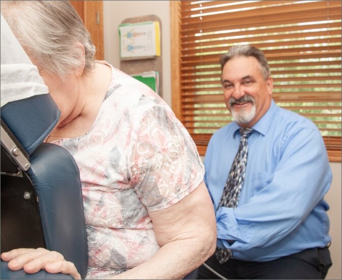 Dr. Kromrey examining woman